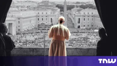 Pope addresses crowd from balcony overlooking St. Peter's Square.