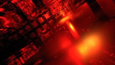 Abstract red and black geometric shapes with bright light.