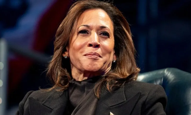 Close-up of Kamala Harris in a dark blazer, looking slightly upward.