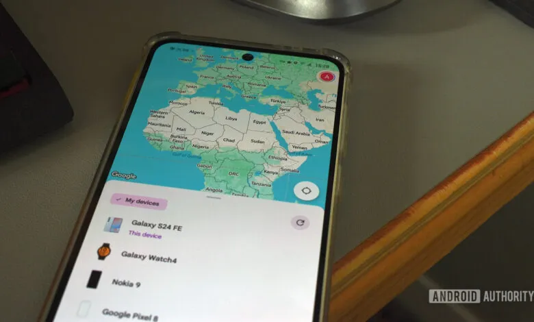 Smartphone displaying Google Find My Device app with a world map.