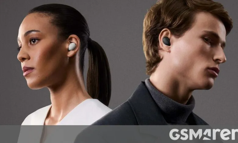 Two people wearing wireless earbuds, one light, one dark, against a gray background.