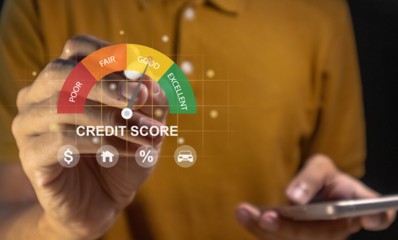 Credit score gauge showing 'Good' rating with hand holding phone.