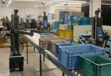 Automated robots sorting colorful bins in a modern warehouse setting.