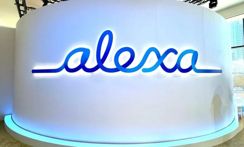 Illuminated Alexa logo on a curved white wall, modern design.