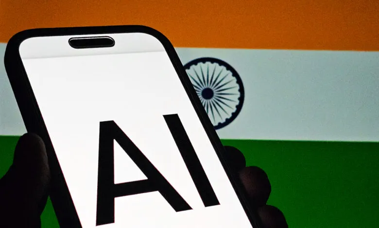 Smartphone displays 'AI' against the Indian flag backdrop.