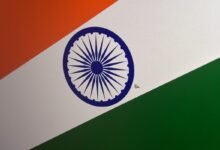 Close-up of the Indian flag with orange, white, and green stripes.