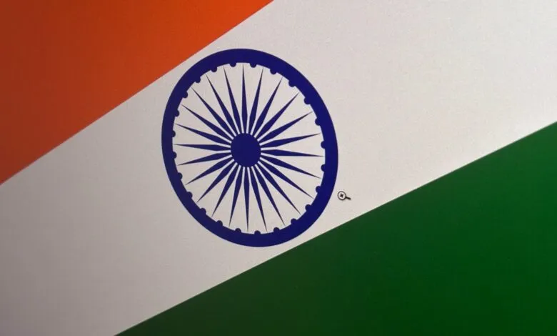 Close-up of the Indian flag with orange, white, and green stripes.