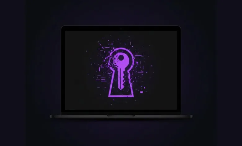 Laptop screen displays a keyhole with a key inside, pixelated and glowing purple.