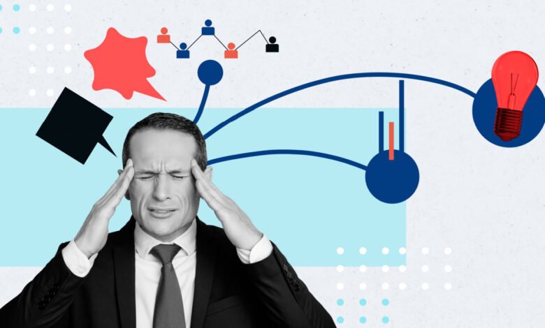 Stressed businessman with headache, surrounded by data visualizations.