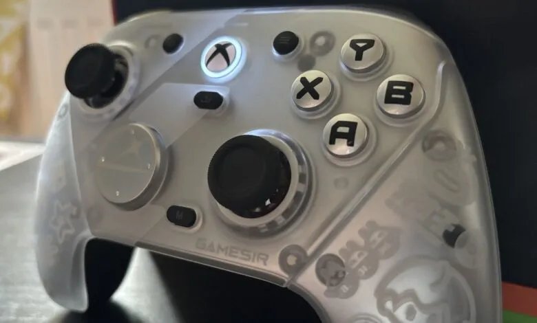 Close-up of a translucent GameSir Xbox controller with illuminated Xbox button.