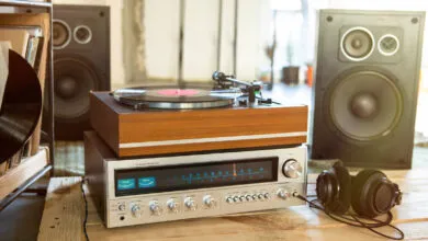 Vintage stereo system with turntable, receiver, speakers, and headphones.