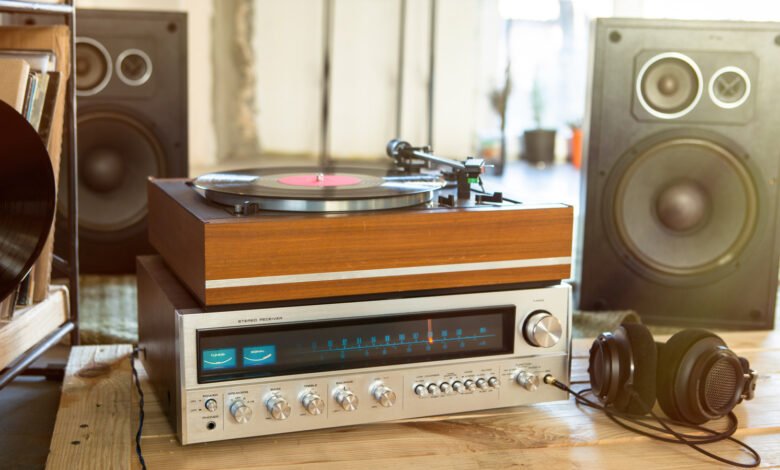Vintage stereo system with turntable, receiver, speakers, and headphones.