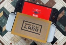 Nintendo Switch with Virtual Boy screen and Nintendo Labo box on patterned table.