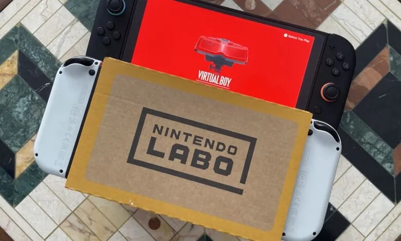 Nintendo Switch with Virtual Boy screen and Nintendo Labo box on patterned table.