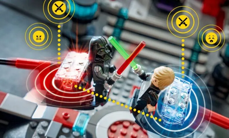 LEGO Star Wars scene with Luke Skywalker and Darth Vader minifigures dueling.