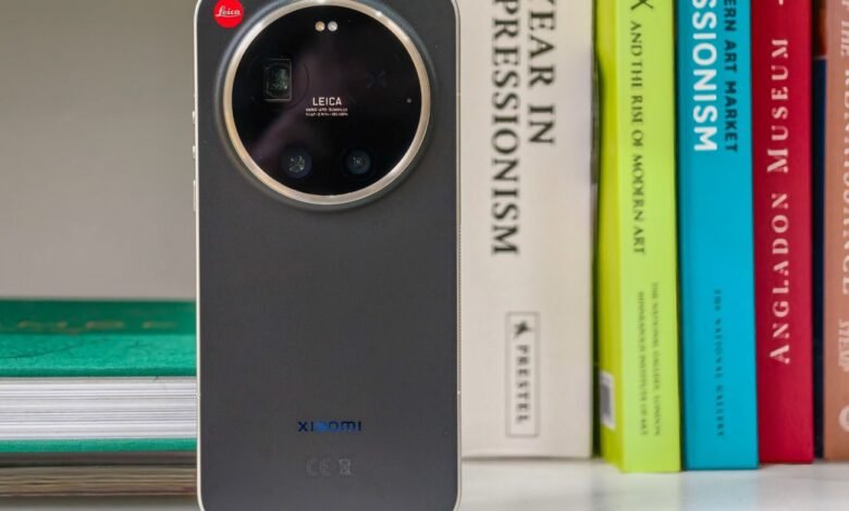 Xiaomi 13 Ultra phone with Leica camera system on a bookshelf.