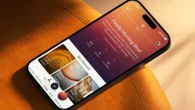 Smartphone displaying health app on orange chair, showing morning brief.