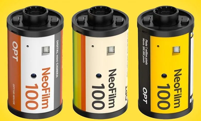 Three NeoFilm 100 digital mini cameras resembling film canisters.