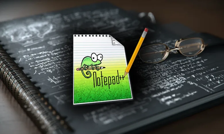 Notepad++ logo on a notepad with pencil and glasses.