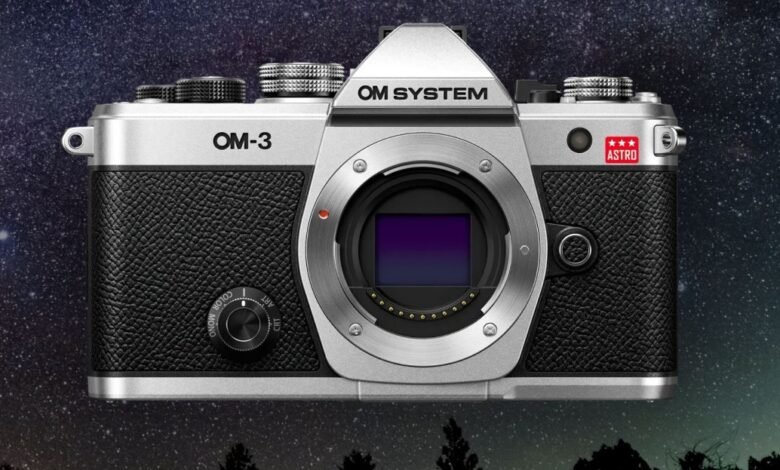 Silver OM-3 Astro camera against a starry night sky background.