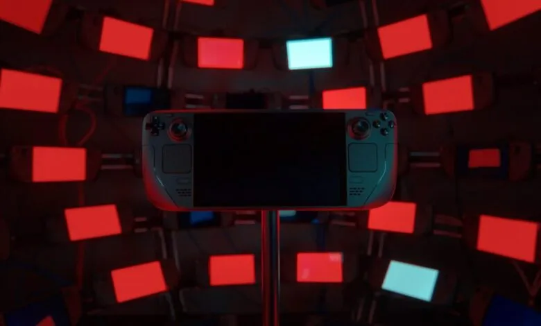 Steam Deck handheld console on display surrounded by glowing screens.
