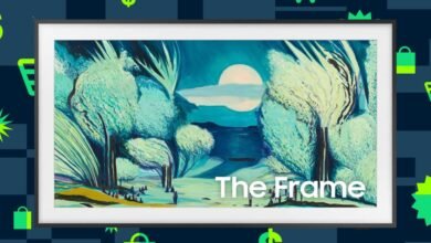 Samsung The Frame TV displaying a landscape painting with trees and a moonlit sky.