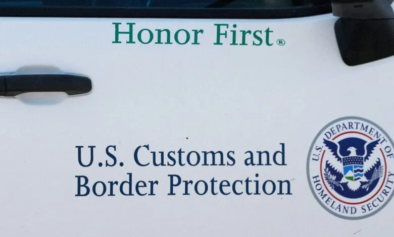 Close-up of a U.S. Customs and Border Protection vehicle with 'Honor First' text.