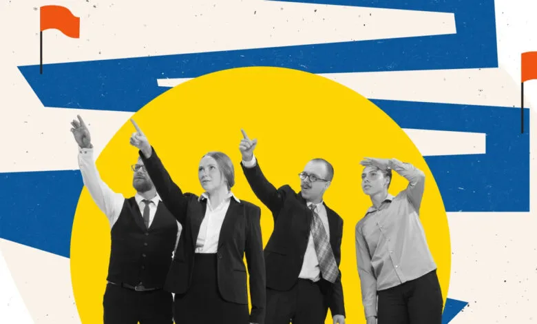 Four business people point upwards against a graphic background.