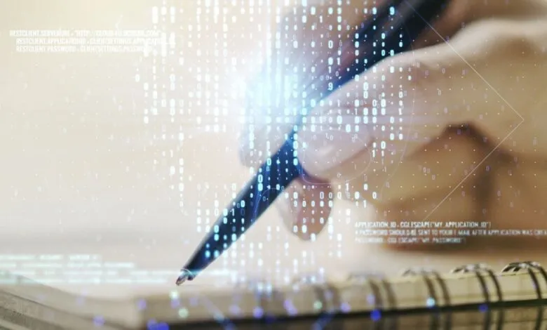 Hand writing on notepad with digital skull overlay, cybersecurity concept.