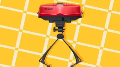 Nintendo Virtual Boy console with stand against a yellow checkered background.