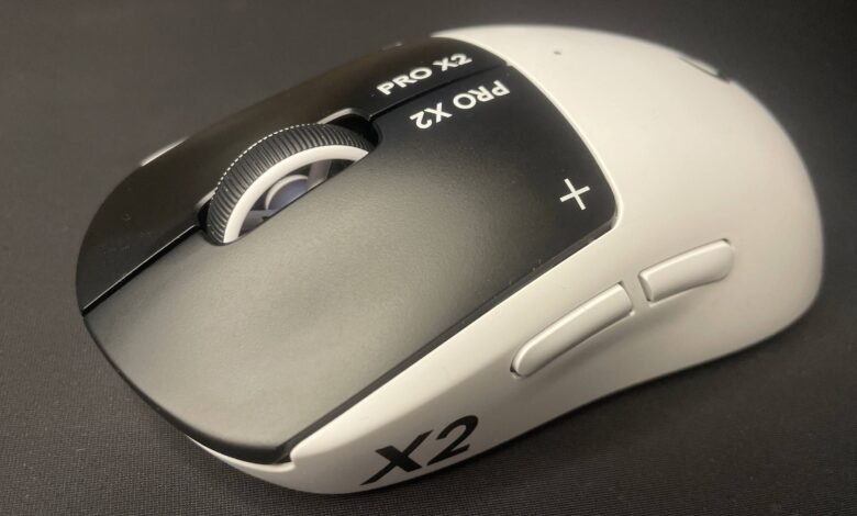 Close-up of a white and black Pulsar X2 Pro gaming mouse.