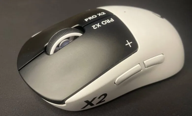 Close-up of a white and black Pulsar X2 Pro gaming mouse.