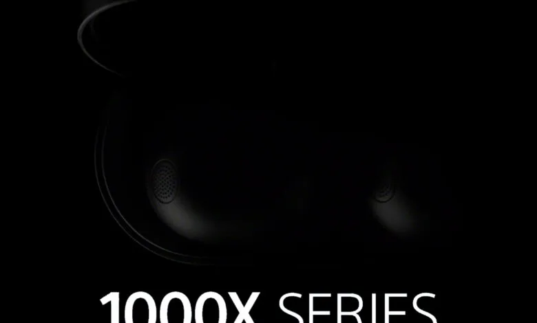 Close-up of Sony 1000X Series earbuds and charging case in dark setting.