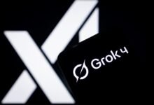 Grok 4 logo displayed on a smartphone with the X logo in the background.