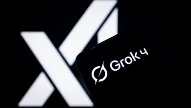 Grok 4 logo displayed on a smartphone with the X logo in the background.
