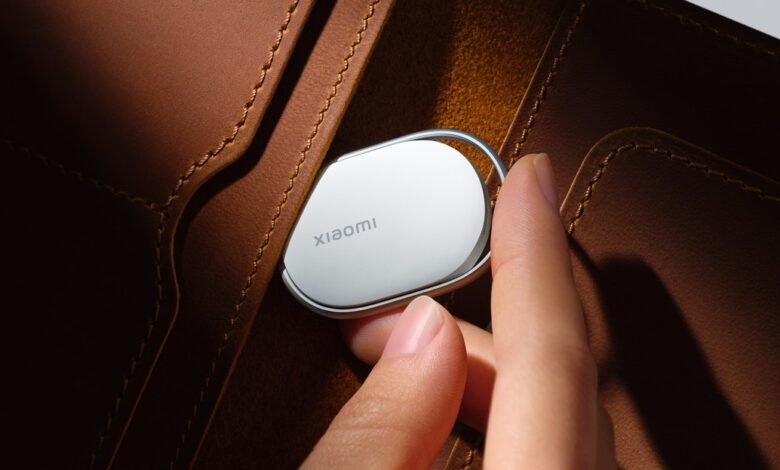 Xiaomi tracker being placed in a brown leather wallet.
