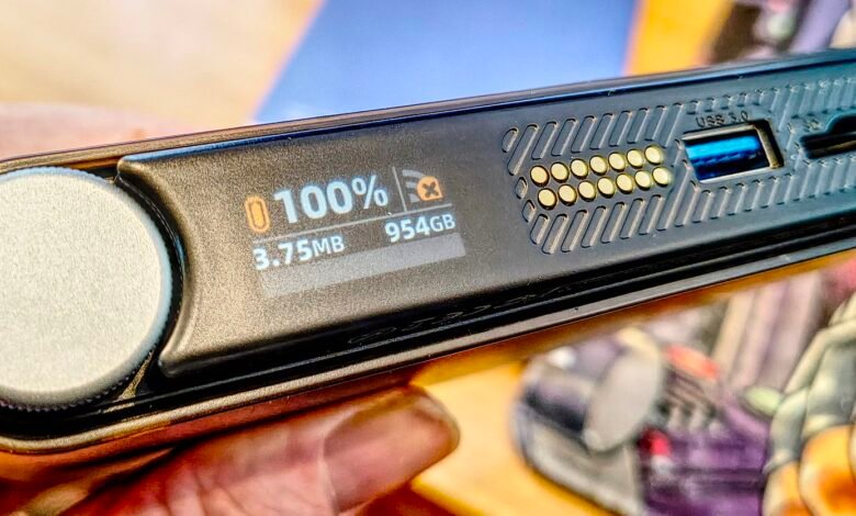 Portable SSD drive showing 100% capacity and USB 3.0 port.