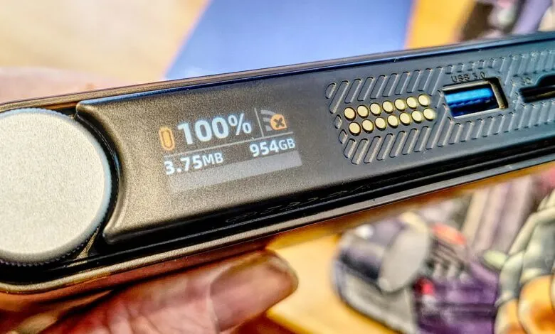 Portable SSD drive showing 100% capacity and USB 3.0 port.