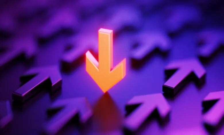 Orange arrow pointing down amidst purple arrows pointing up.