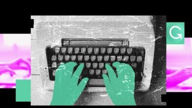 Hands typing on a vintage typewriter with a Grammarly logo overlay.