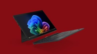 Lenovo ThinkPad X13 Detachable tablet with keyboard on red background.