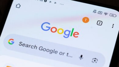 Smartphone screen showing Google search page with logo and search bar.