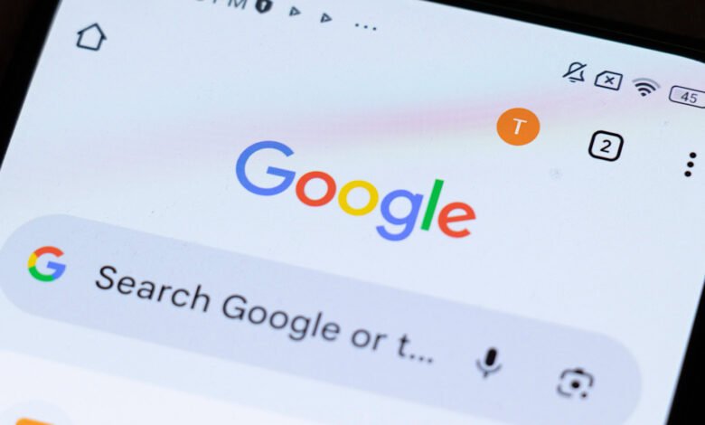 Smartphone screen showing Google search page with logo and search bar.