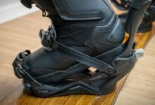 Close-up of a black snowboard boot secured in a Jones Mercury binding.