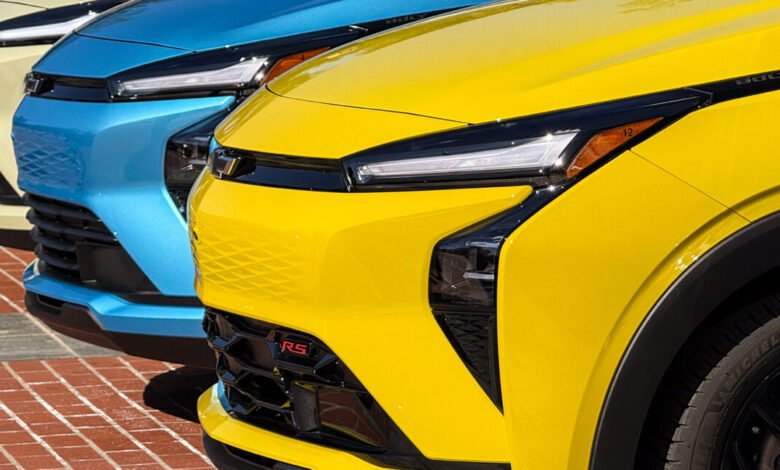 Close-up of three colorful Chevrolet Bolt EUVs in yellow, blue, and beige.