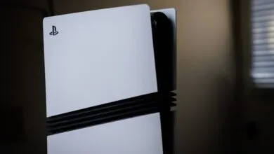 PlayStation 5 console standing vertically, white panels.
