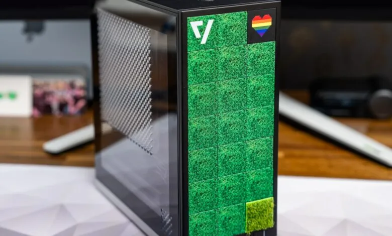 Framework Desktop Mini PC with grass and rainbow heart design.