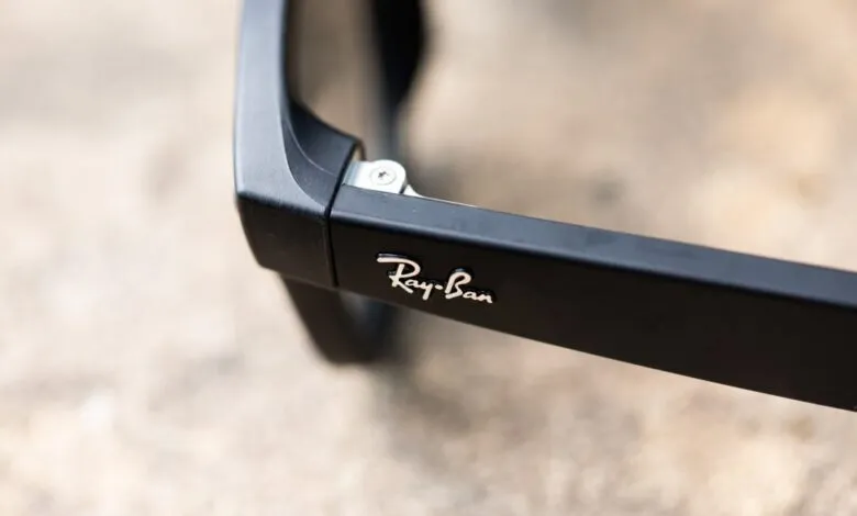 Close-up of black Ray-Ban sunglasses arm with logo detail.