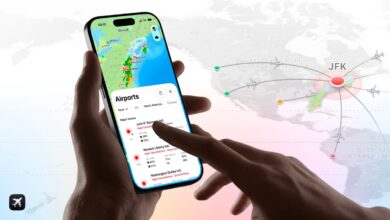 Person using flight tracking app on phone showing airport delays and cancellations.