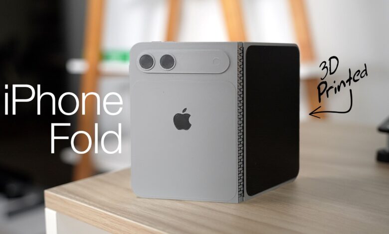 3D-printed iPhone Fold prototype showing folding design and Apple logo.